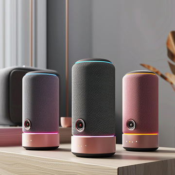 Three smart speakers on a wooden surface with a neutral background
